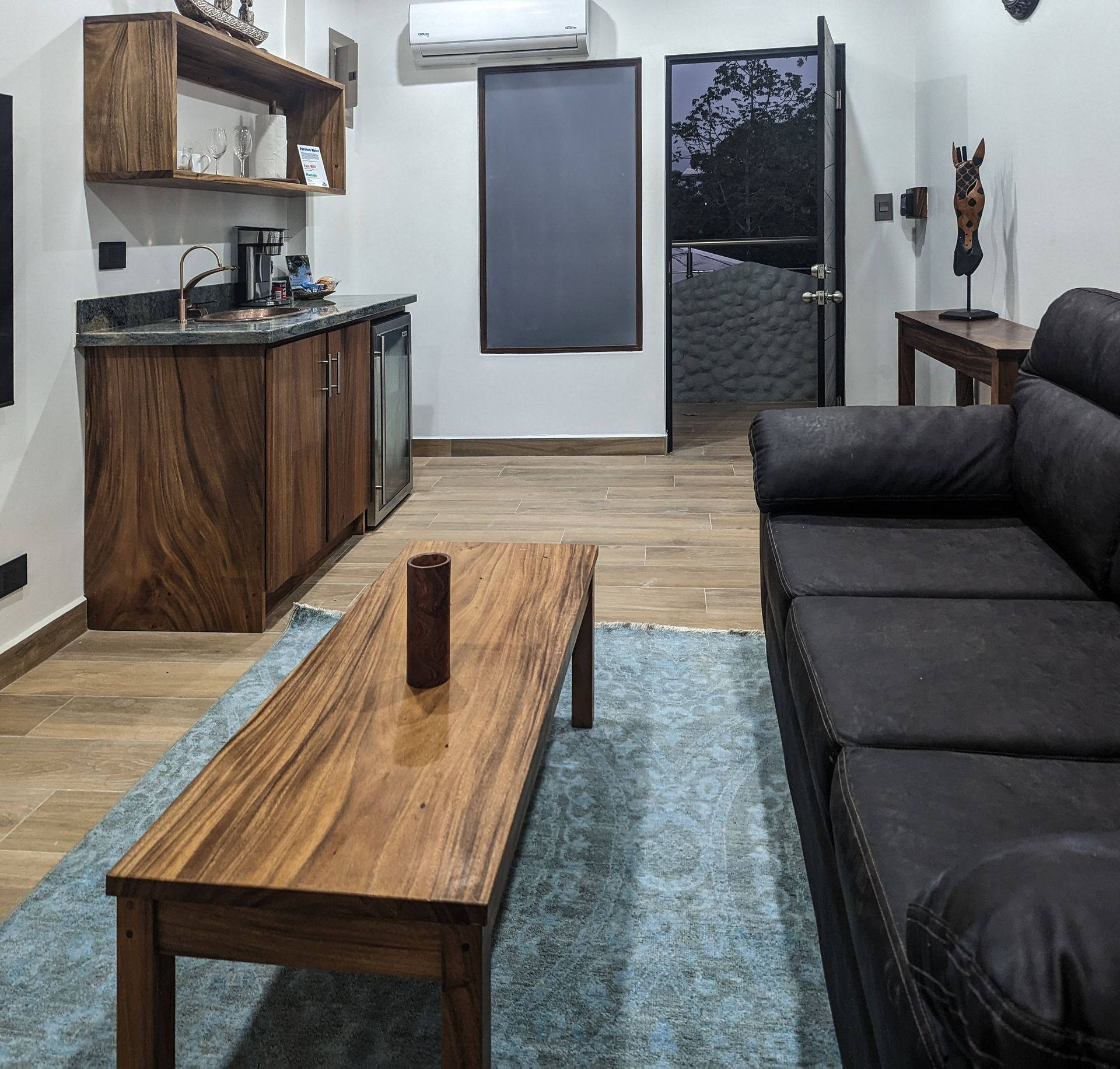 A living room with a couch and a coffee table