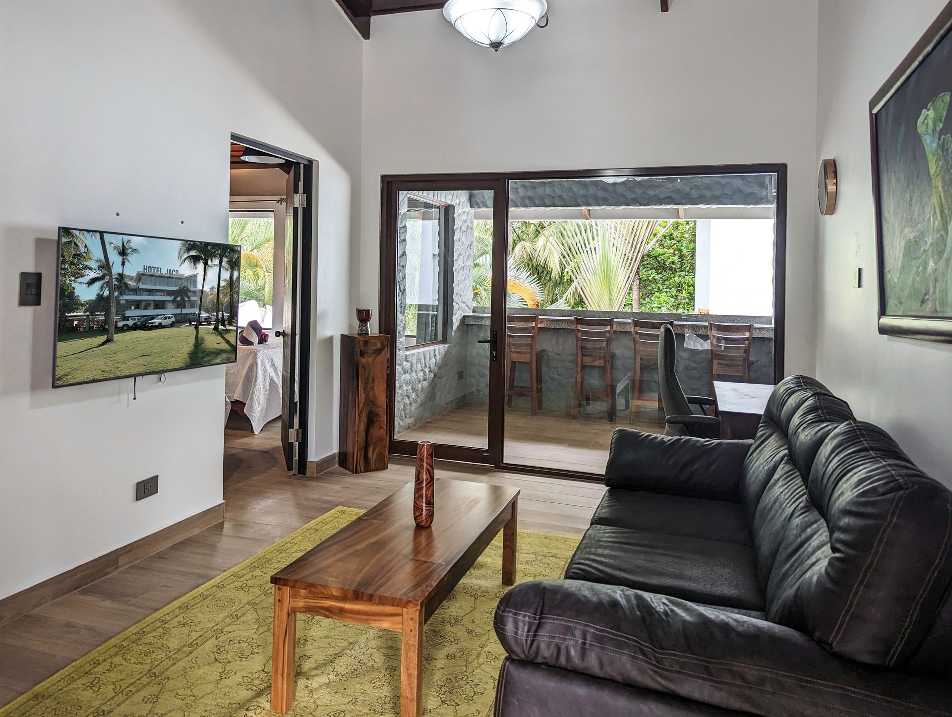 A living room with a couch , table and television