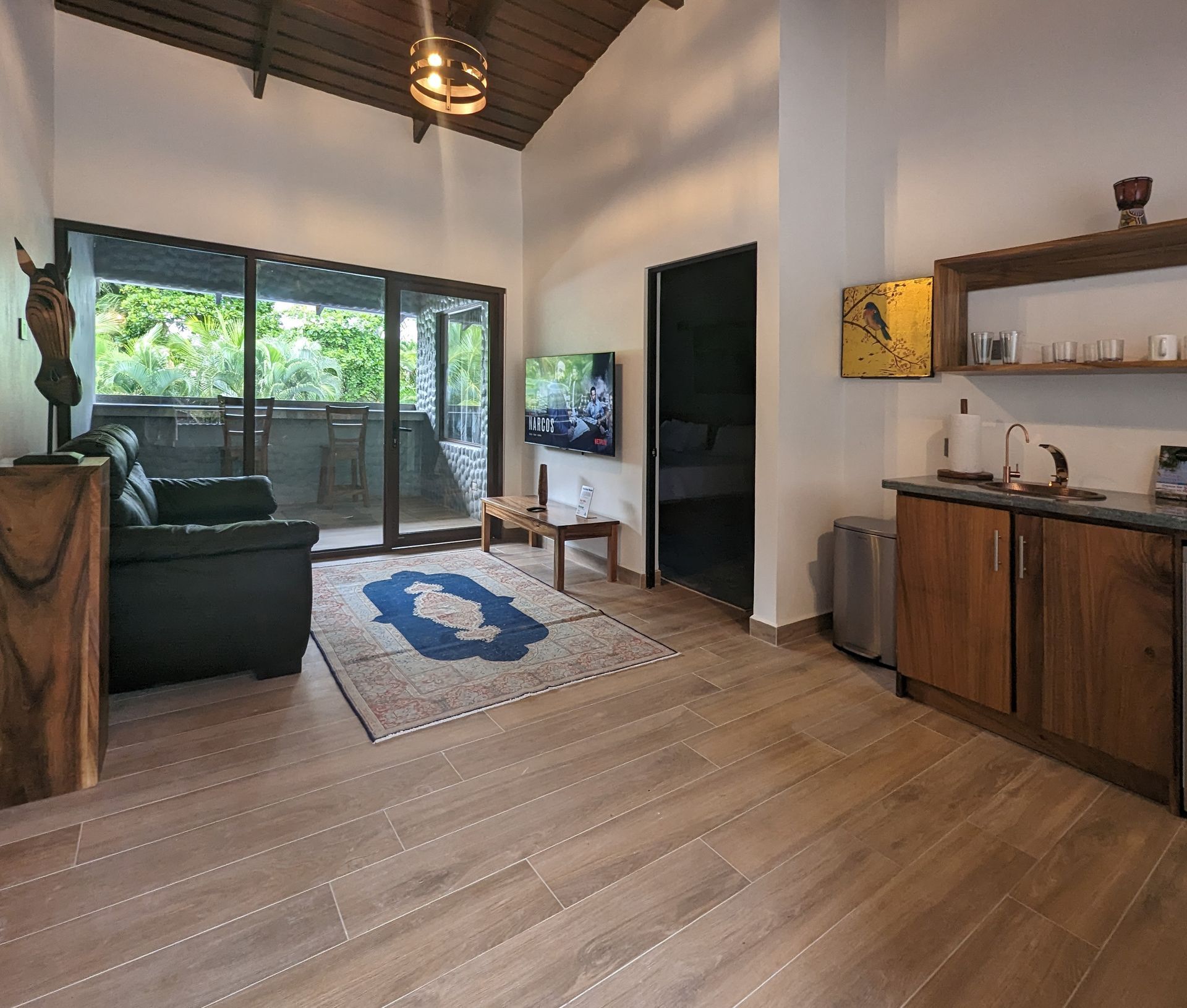 A living room with a couch and a flat screen tv