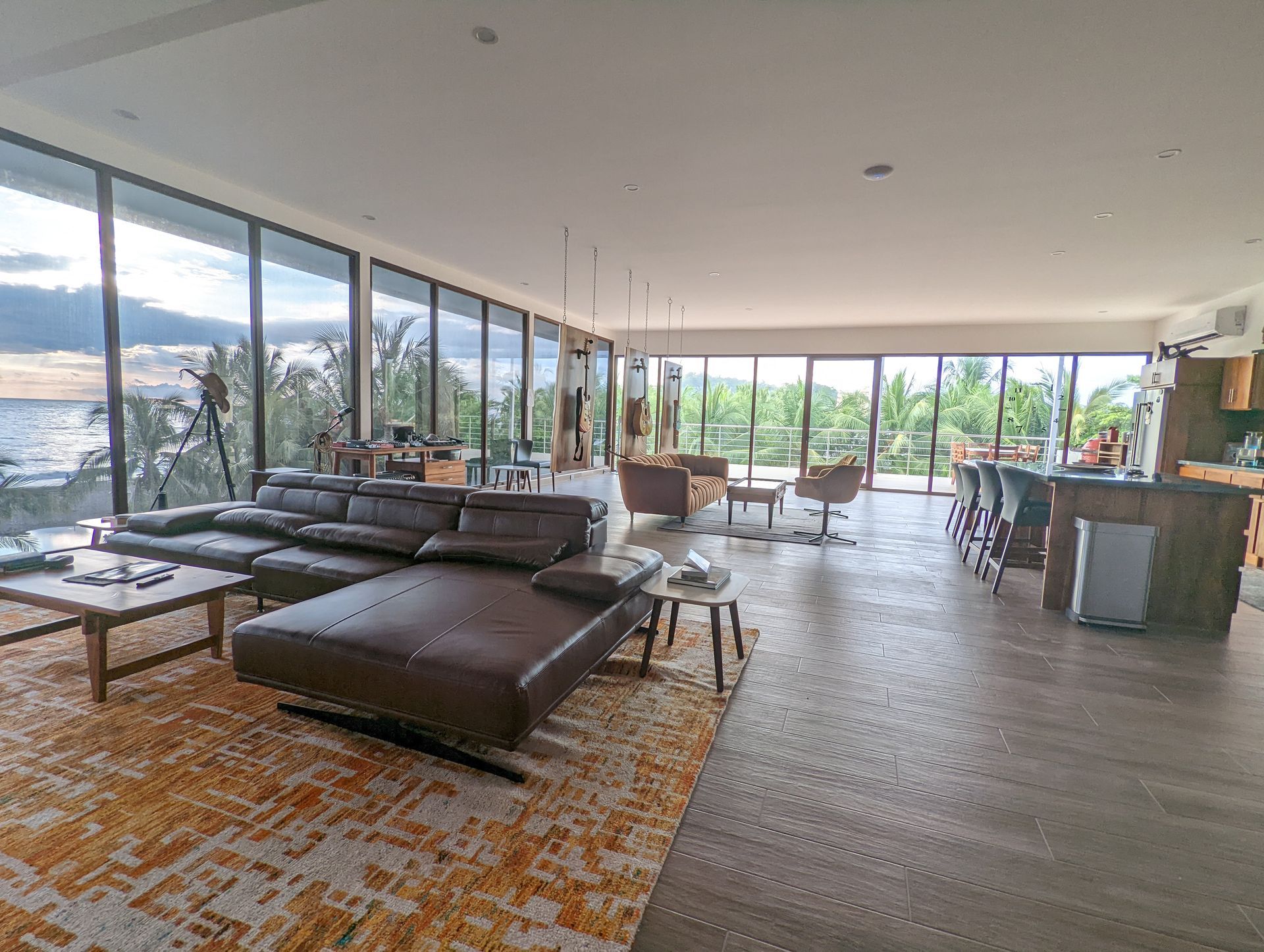 A living room filled with furniture and a large window.