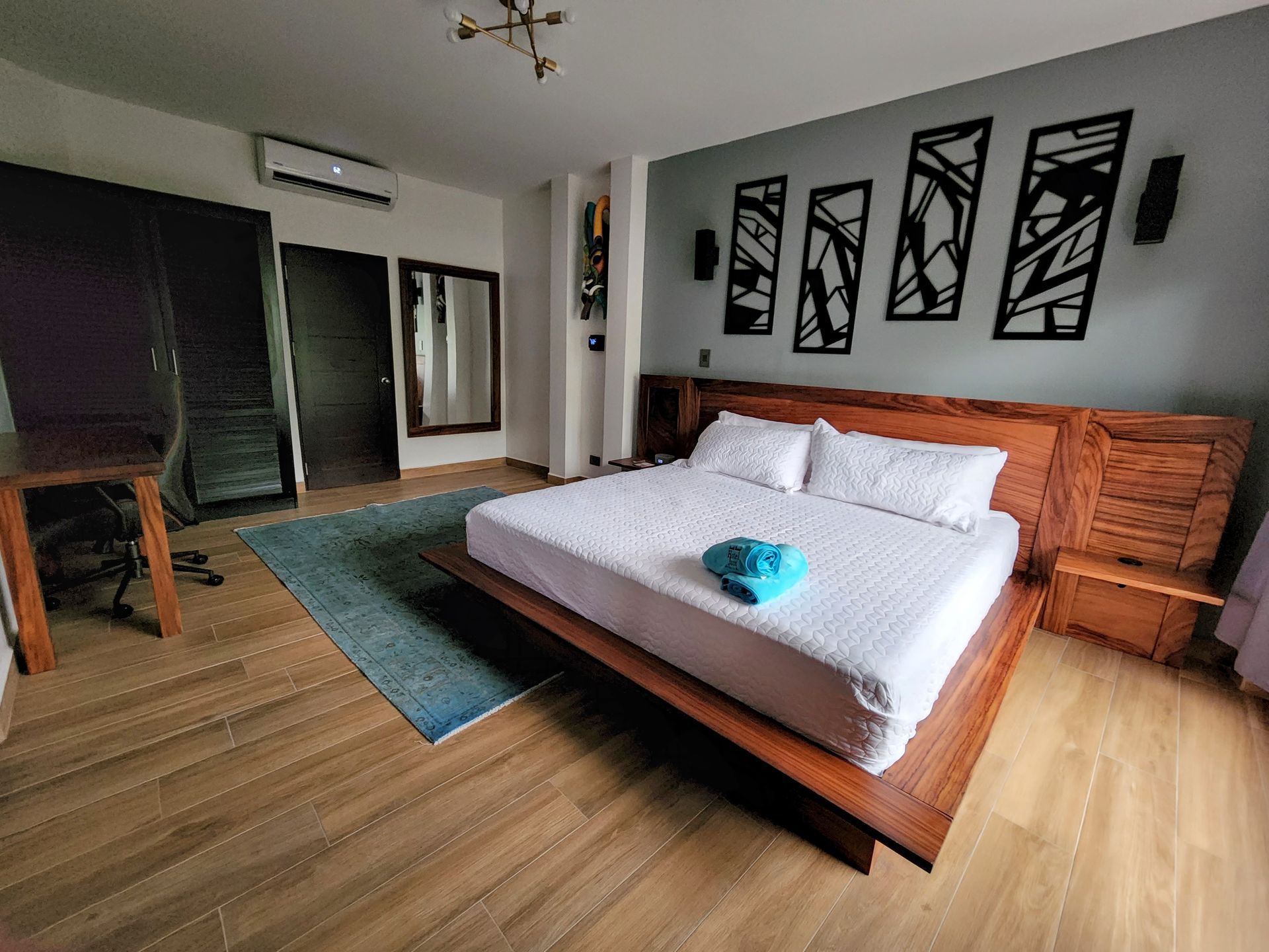 There is a large bed in the middle of the room.