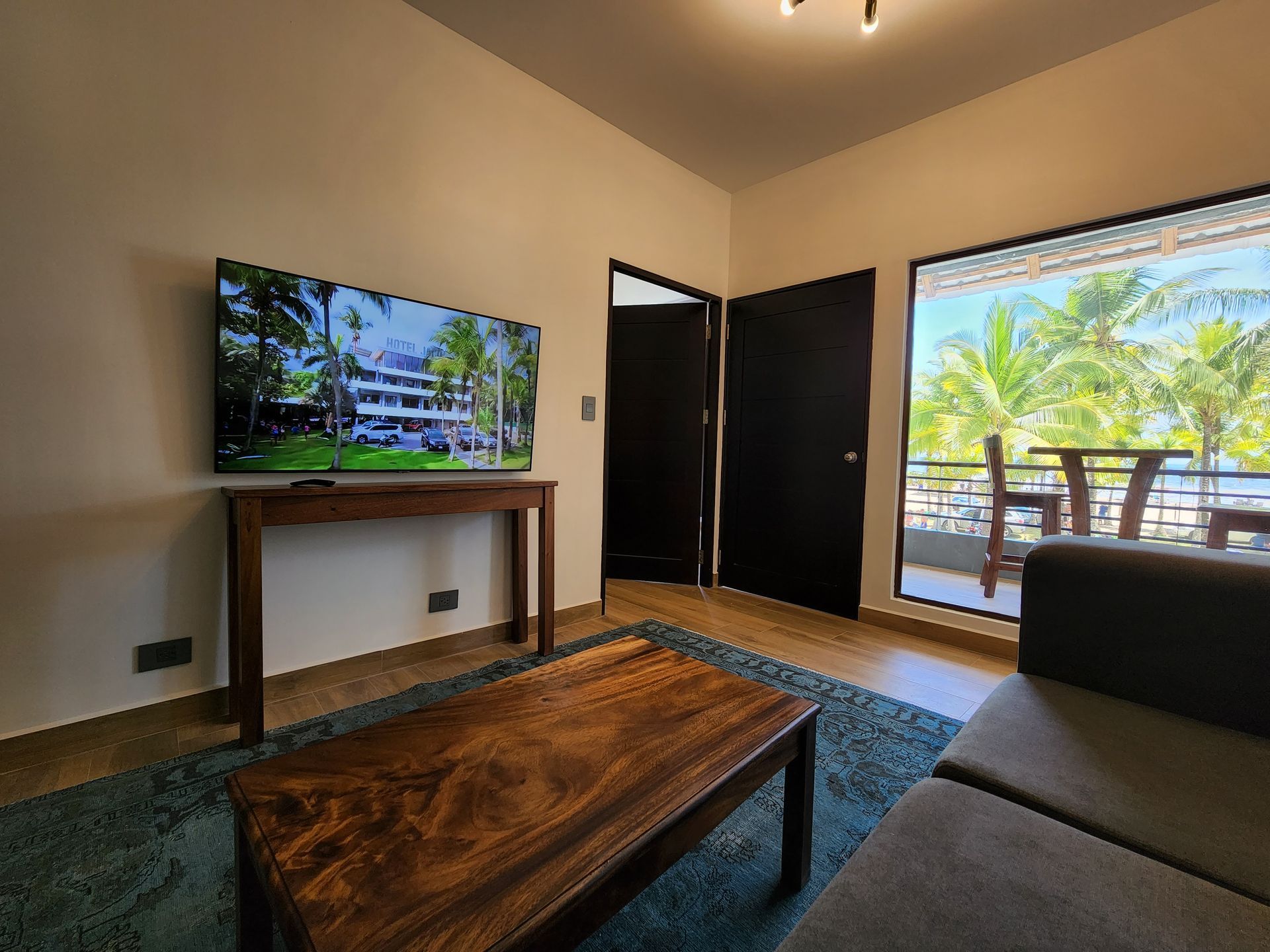 A living room with a couch , table , and television.
