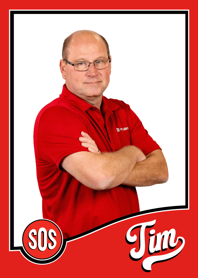 Tim is the BUsiness Development Director of 30 years. He is standing with his arms crossed.