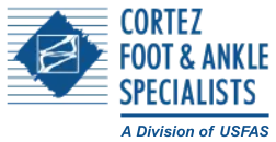 The logo for usfas foot and ankle specialists is blue and gray.