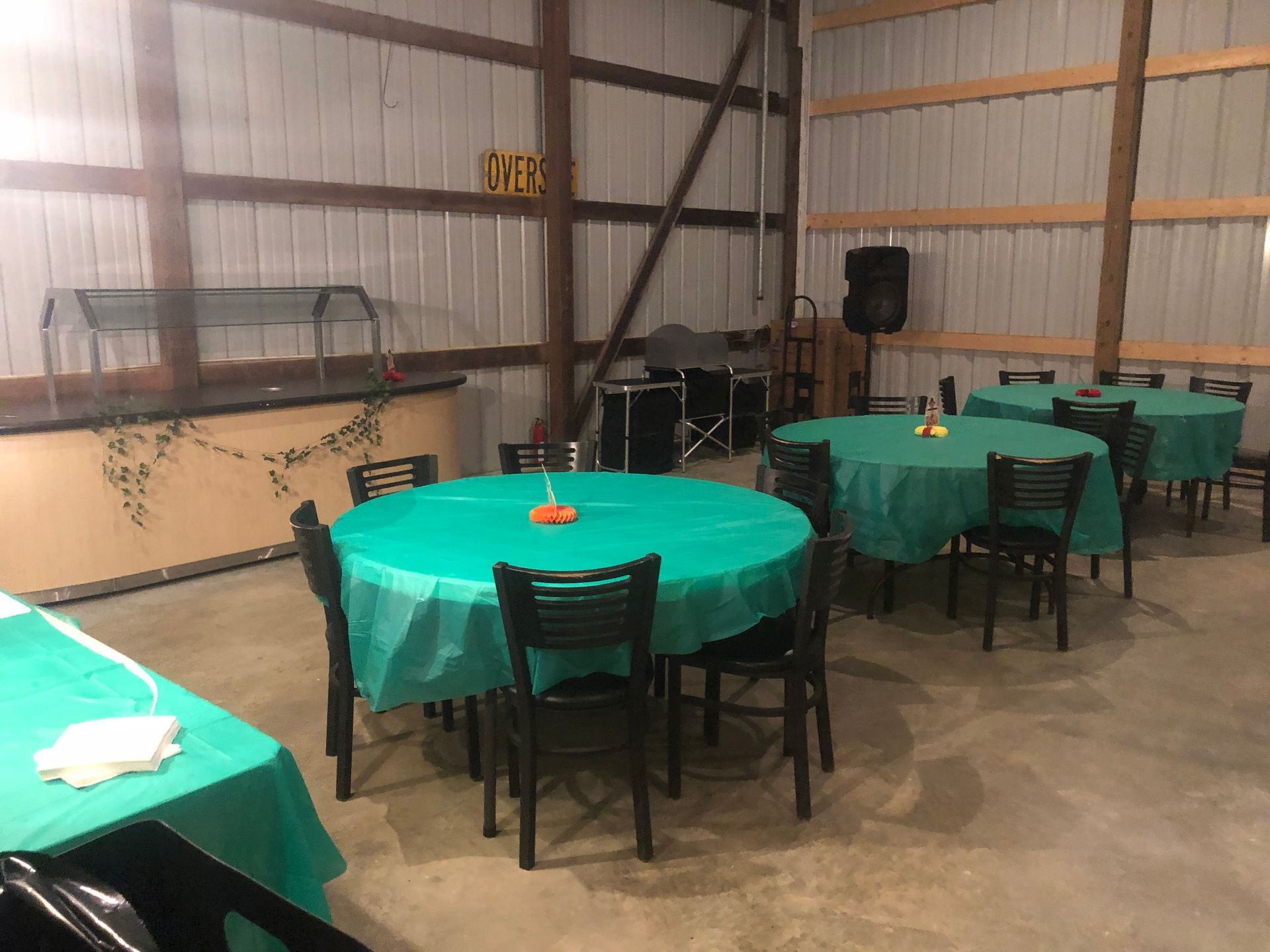 a large room with tables and chairs set up for a party .