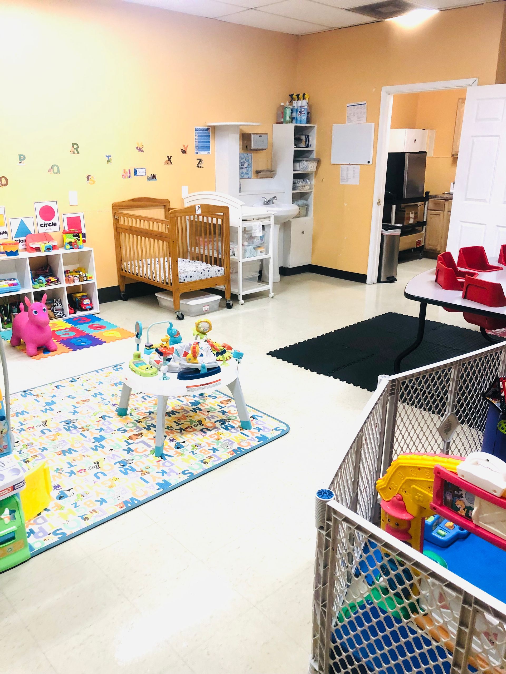a room filled with lots of toys and a crib .