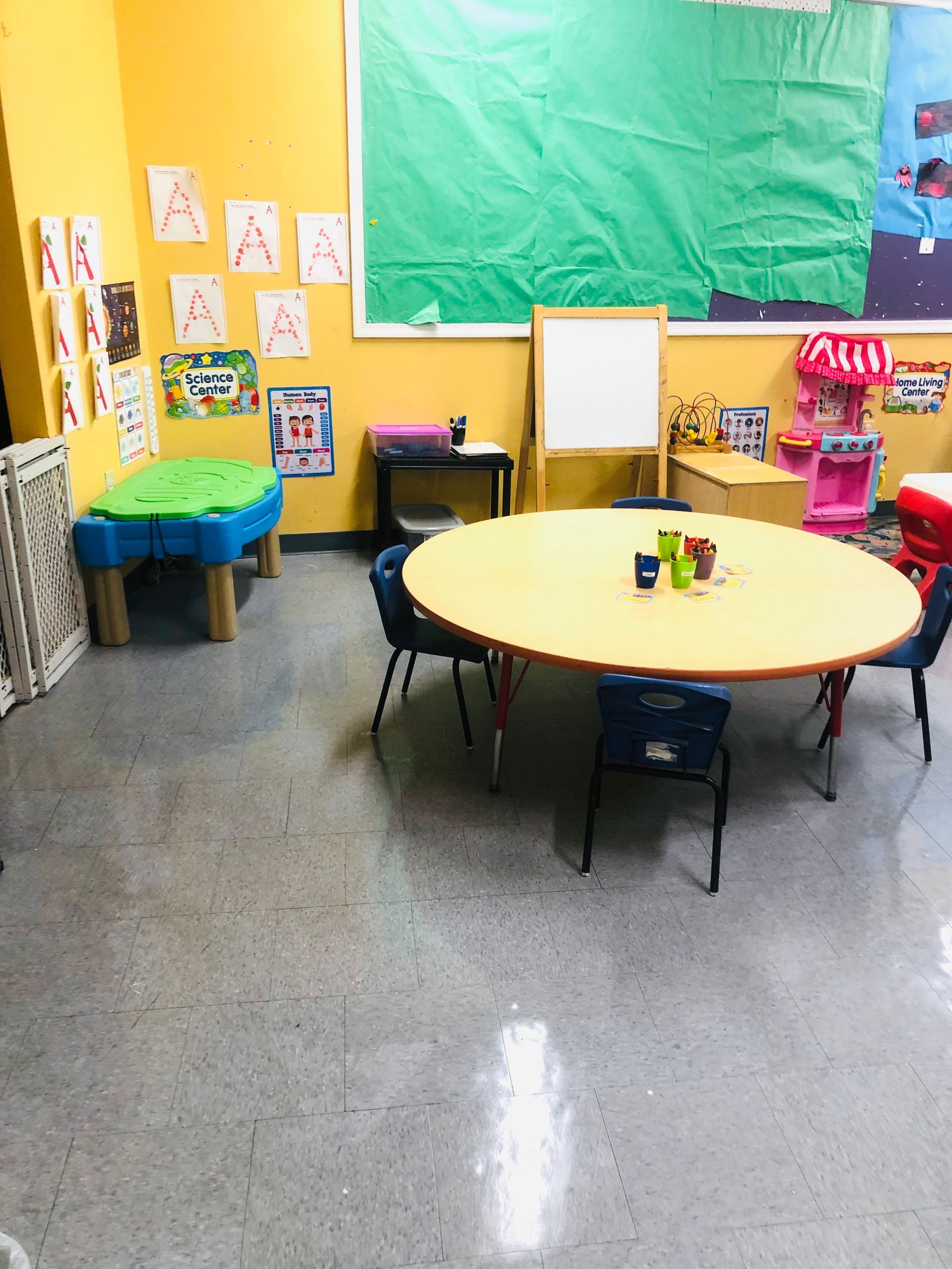 a room with a round table and chairs in it