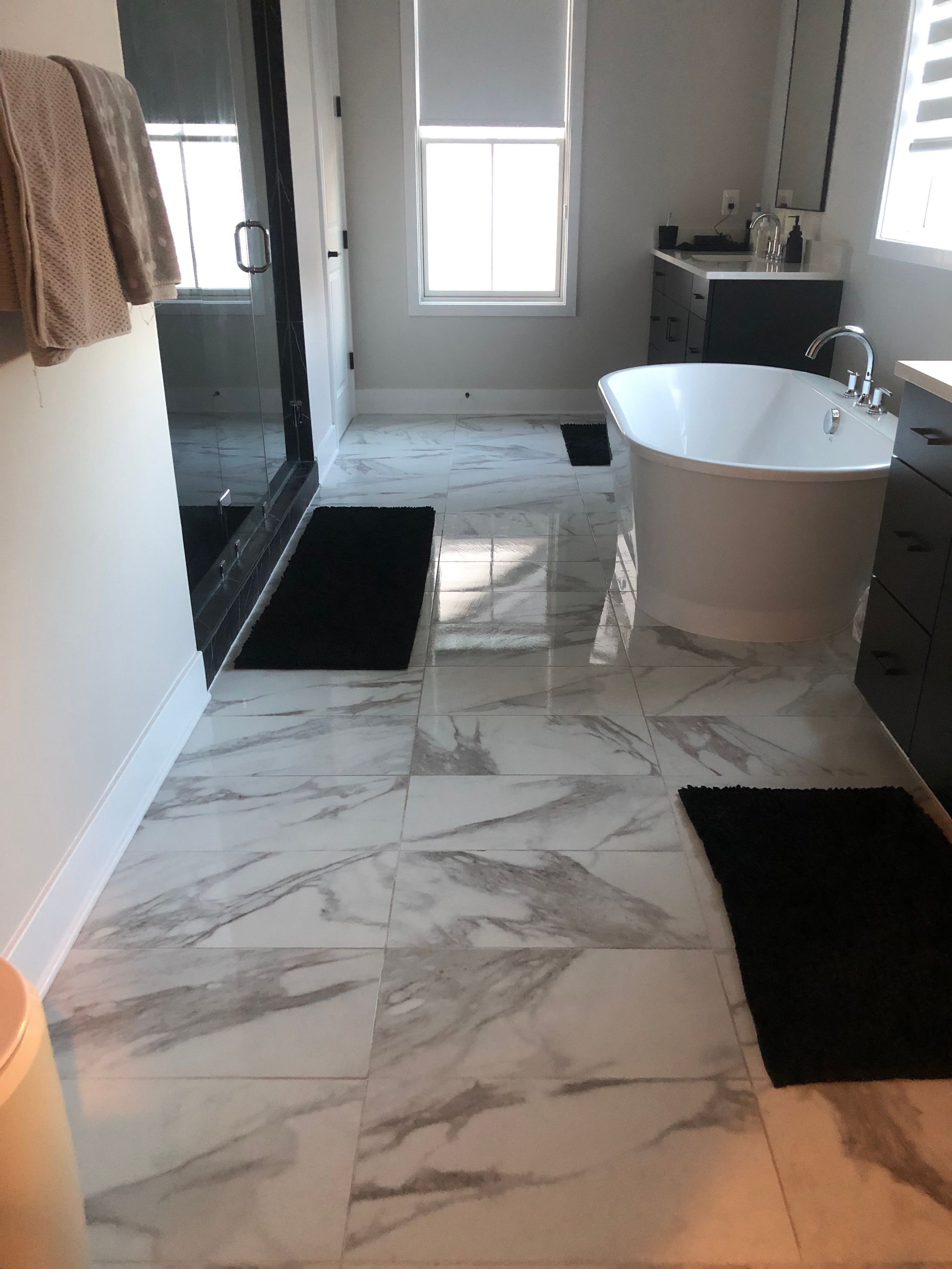 there is a bathtub in the middle of the bathroom .