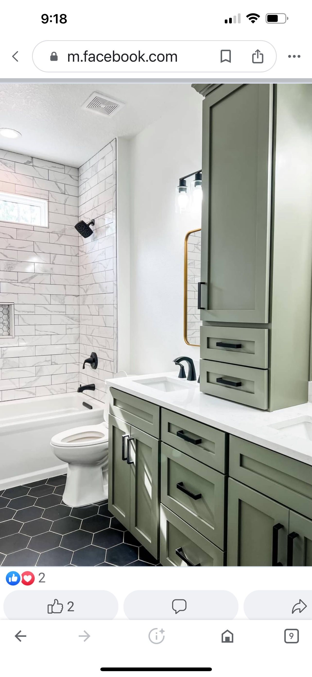 A bathroom with green cabinets , a toilet , and a bathtub.
