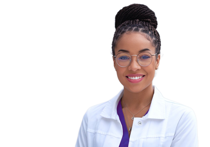 A woman in a lab coat and glasses is smiling.