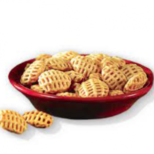 Bowl of waffle-shaped, golden-brown snack crackers in a red bowl.