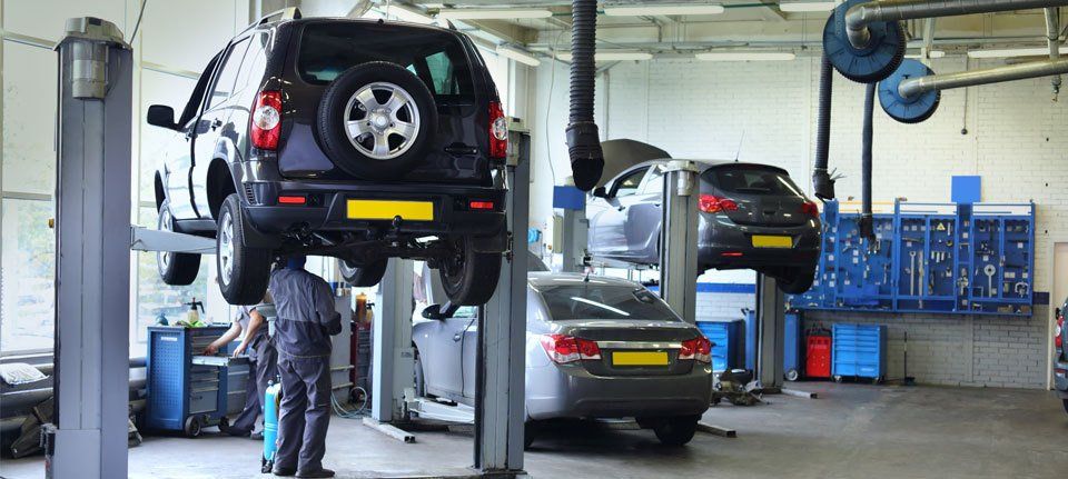 A MOT station with cars being tested