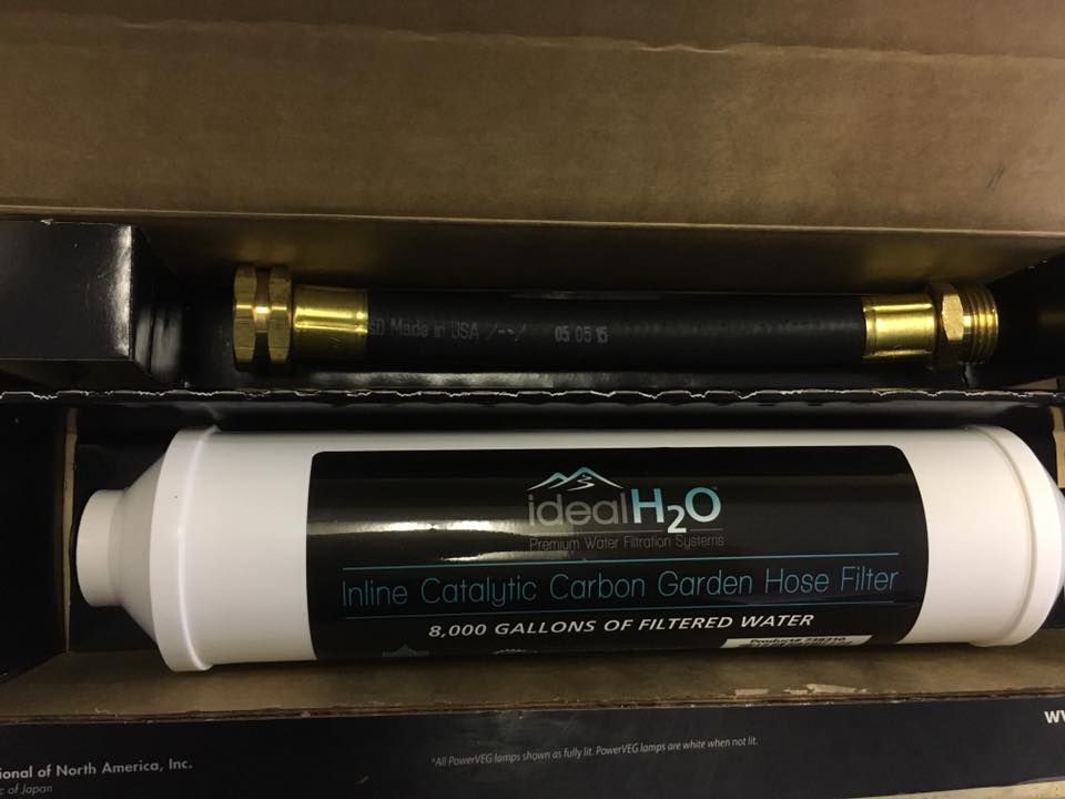 Inline water filter and hose in box, labeled 