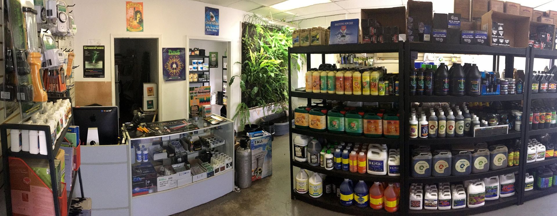 Interior of a store selling various products, with shelves filled with bottles and containers.