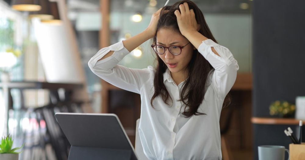 Businessperson worried about HR compliance risk