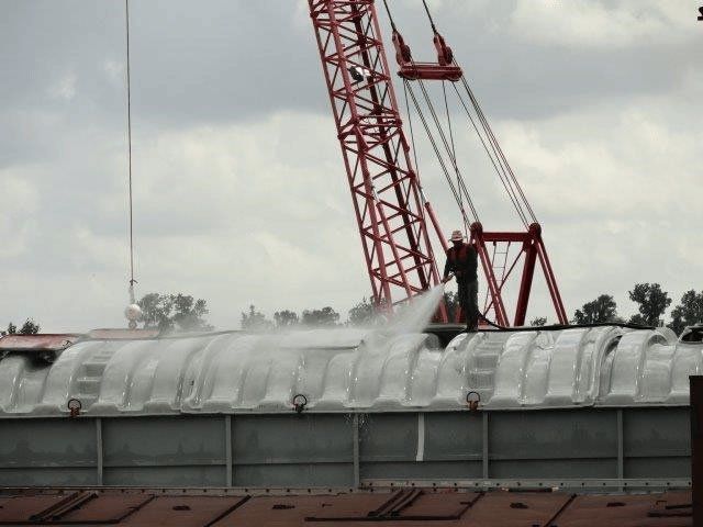 Man Cleaning the White Roof — Gretna, LA — Advanced Industrial Products