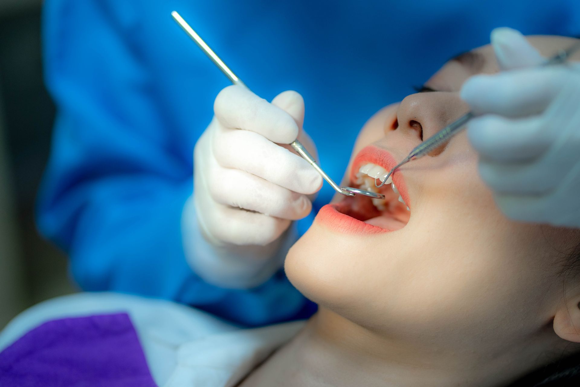 Dentist examining a patient's teeth in the dentist.
