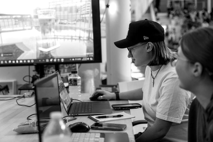 A black and white photo of two people working together on an Urban Studies project 