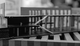 A black and white photo of a model of a building.