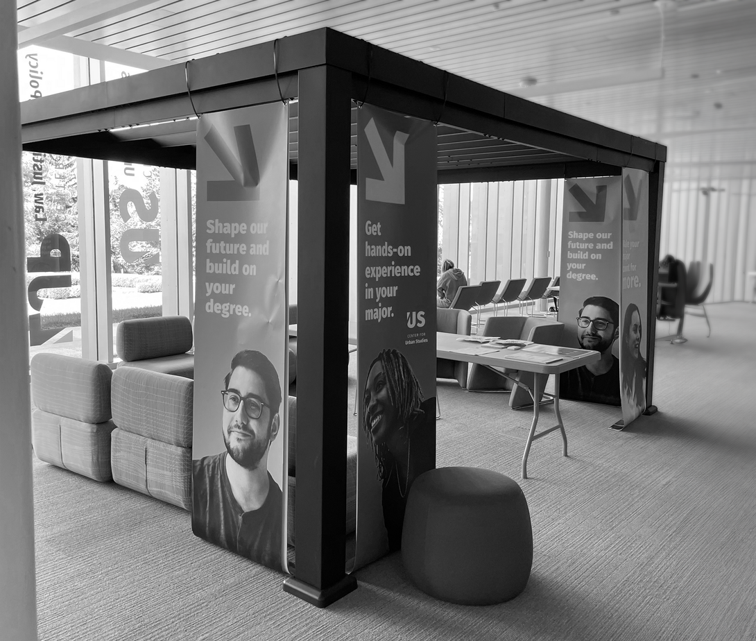 A black and white photo of a room on the  Marywood Campus with tables and chairs