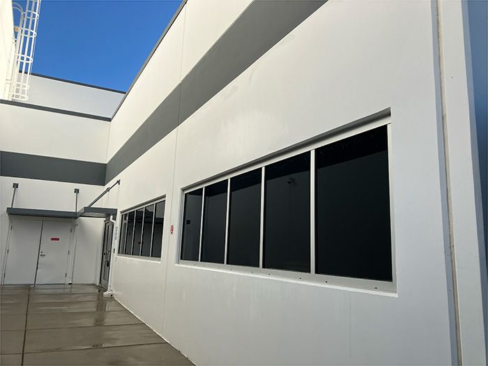 A white building with a lot of windows on it