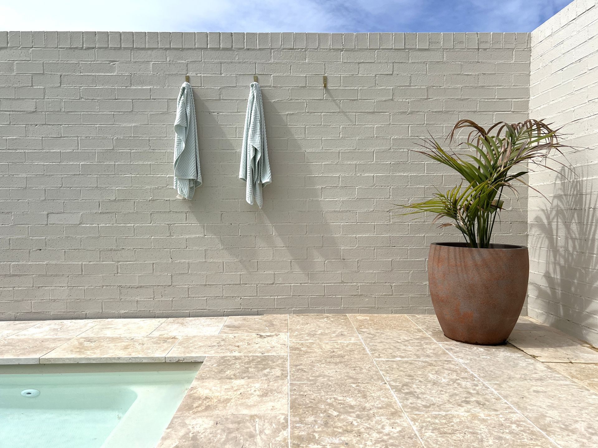 There is a Large Plain Design of Swimming Pool in the Backyard of a House — SJ Pools and Concreting in Dubbo, NSW