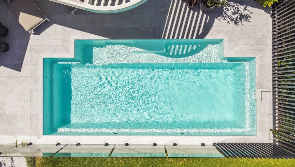 A bird eye point of view of a Large Swimming Pool surrounded by tiles — SJ Pools and Concreting in Dubbo, NSW