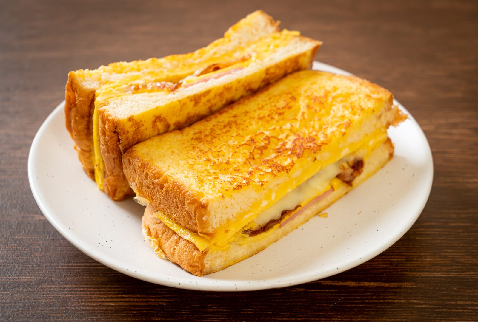 A plate of fragrant nasi lemak with sambal, featuring fluffy coconut rice topped with spicy sambal sauce