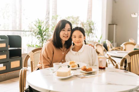 A mother and daughter sharing a moment dining at Tea Garden