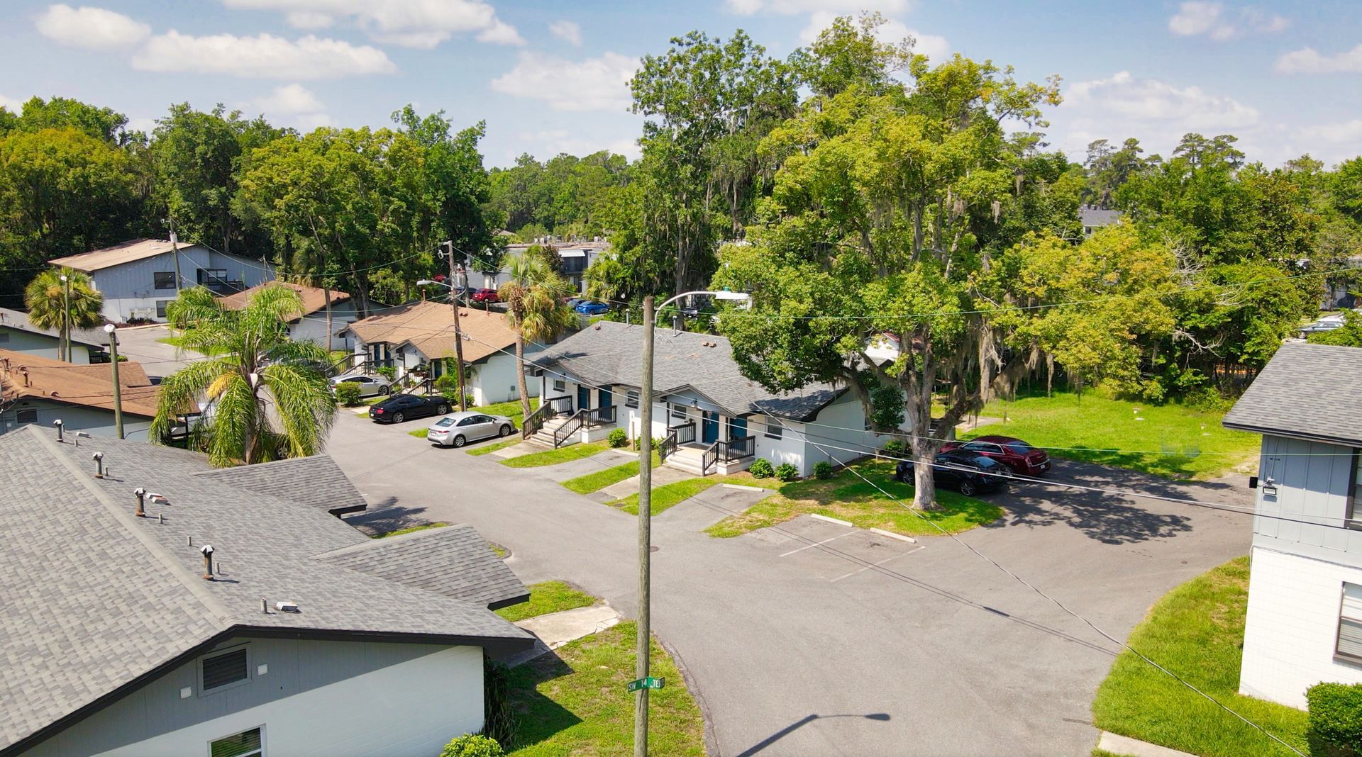 An aerial view of a residential neighborhood with houses and trees.