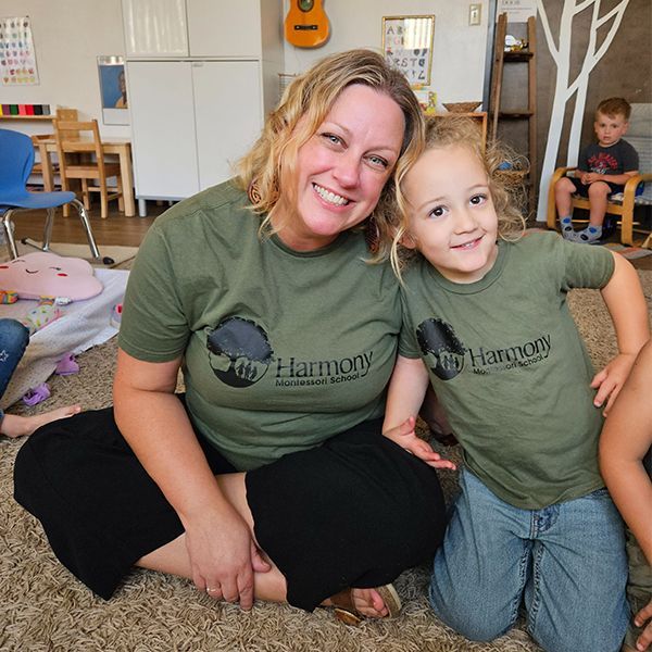 Child and guide in a Montessori classroom