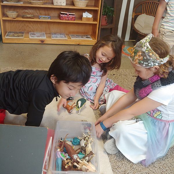 montessori children happy playing inside the classroom