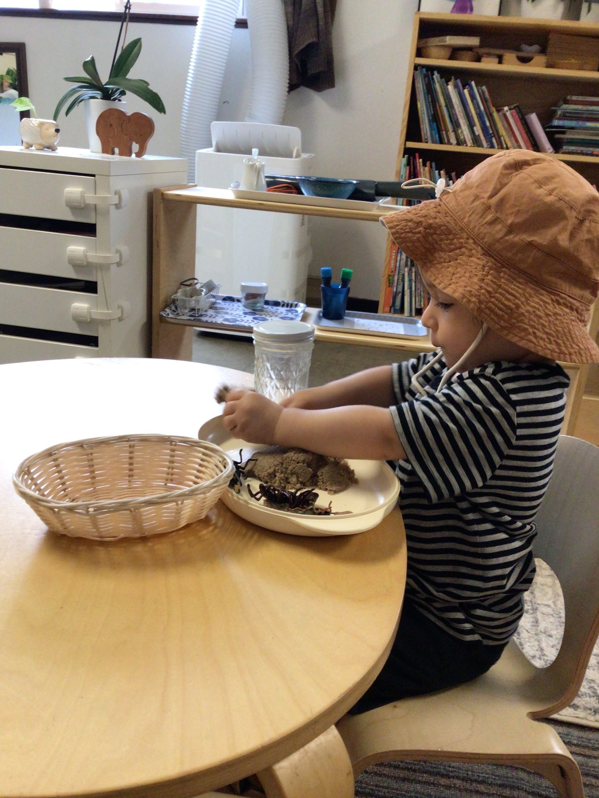 montessori toddler working with practical life skills