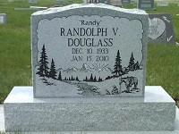 Gravestone of Randolph V. Douglass, with engraved mountain scene, dates Dec 10, 1933 - Jan 15, 2010.