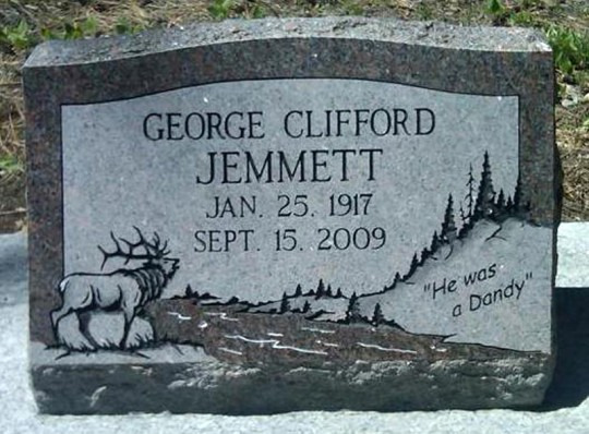 Tombstone of George Clifford Jemmett. Dates 1917-2009, with a drawing of elk, mountains, and the phrase 