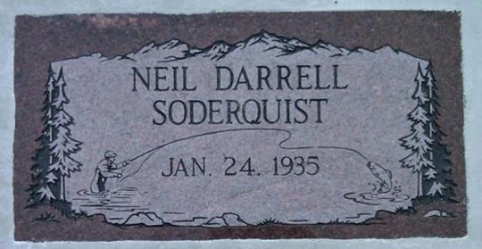 Gravestone with a fisherman and a leaping fish; mountains and trees border the design. Name and birthdate.