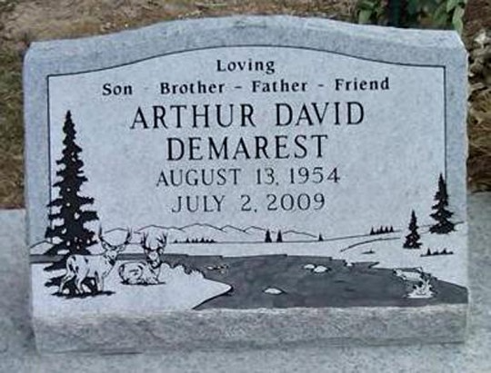 Headstone for Arthur David Demarest, with birth and death dates, and a landscape design.