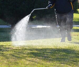 Man Spraying Fertilizer — Landscaping Services in West Lawn, PA