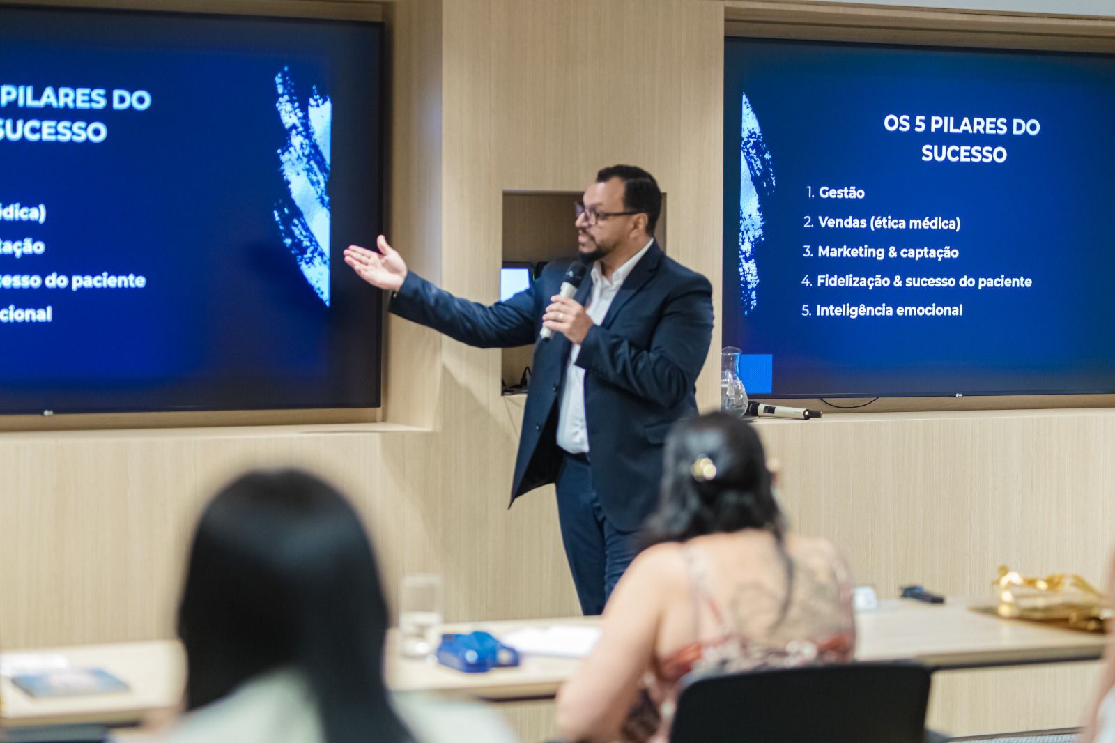 A speaker presents the 