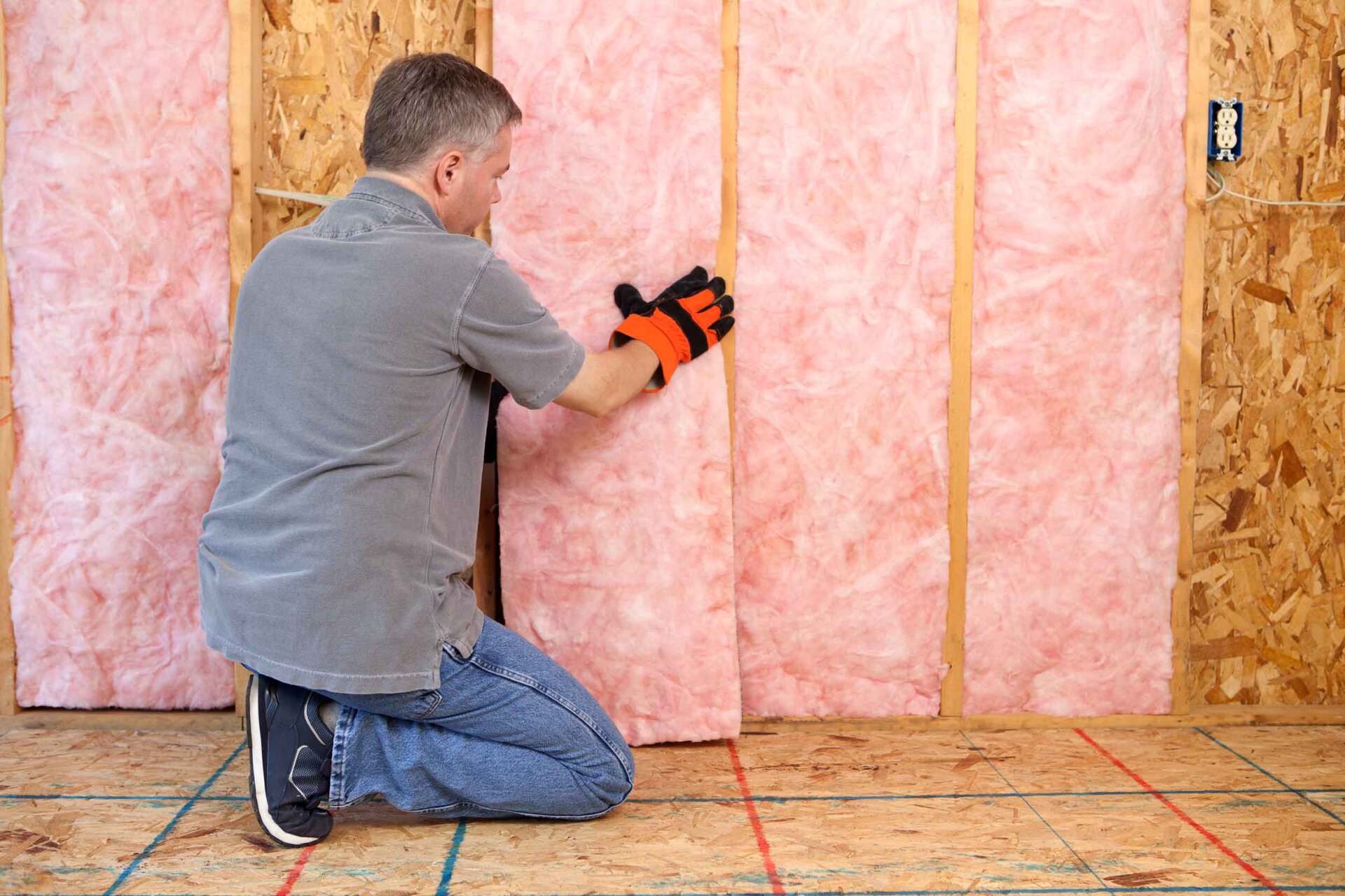 Man Installing Insulation — Jacksonville, FL — North Florida Insulation
