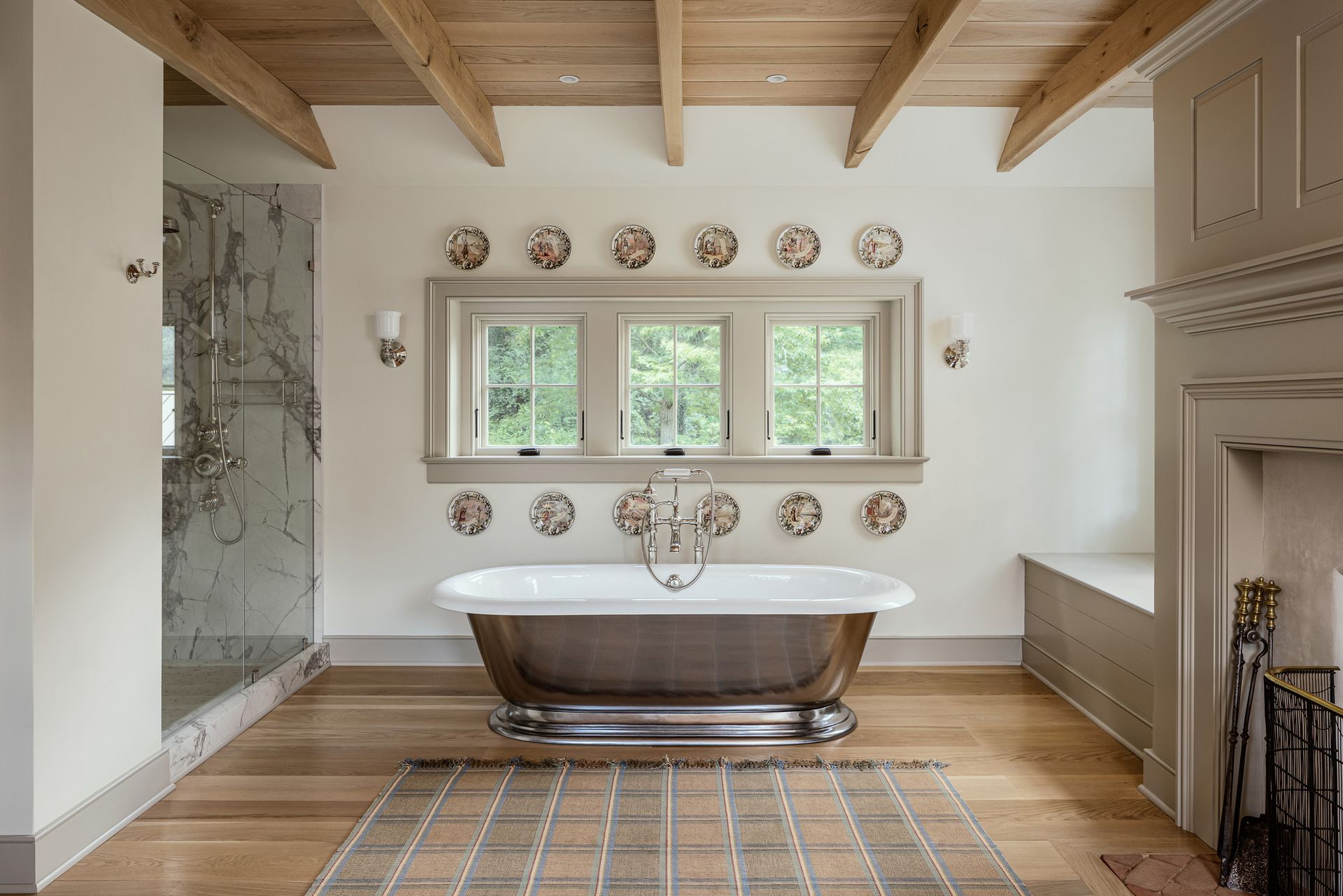 There is a bathtub in the middle of the bathroom.