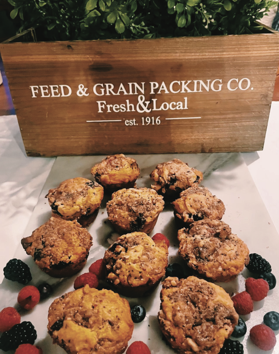 A wooden box that says feed & grain packing co. on it