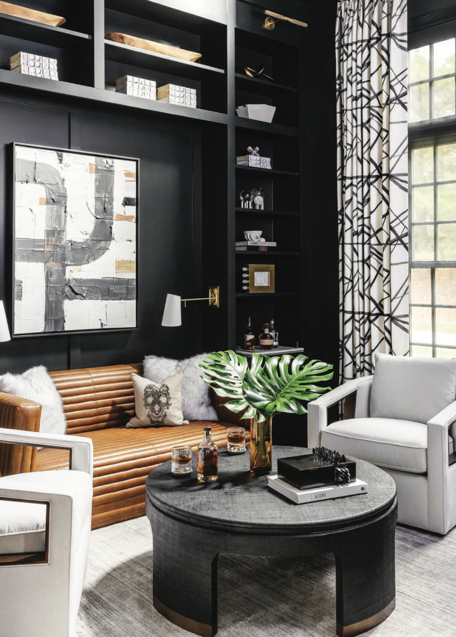 A living room with a couch , chairs and a coffee table