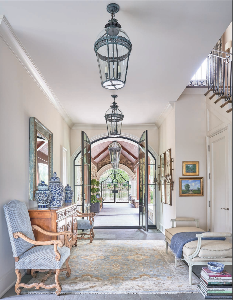 A hallway with lanterns hanging from the ceiling