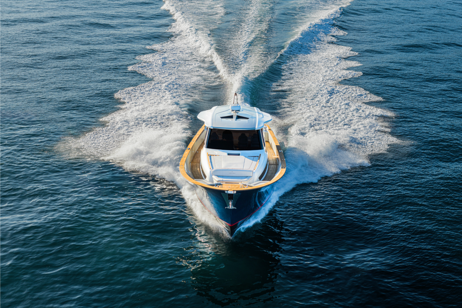 A boat is floating on top of a body of water.