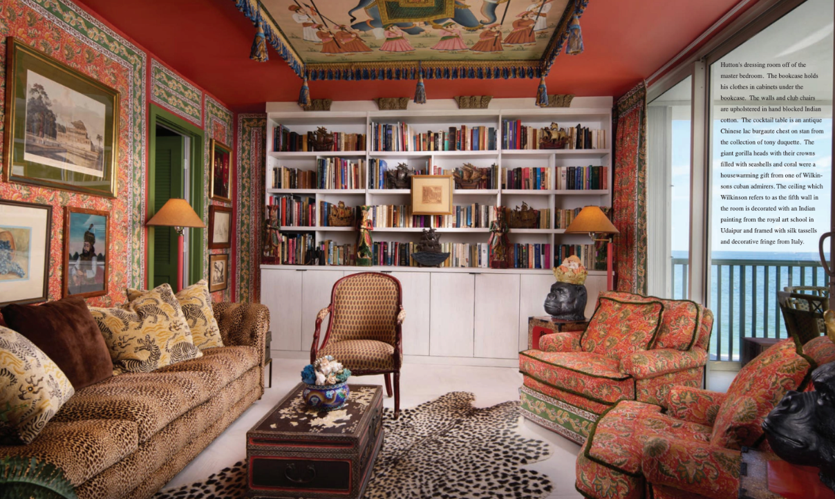 A living room filled with furniture and bookshelves