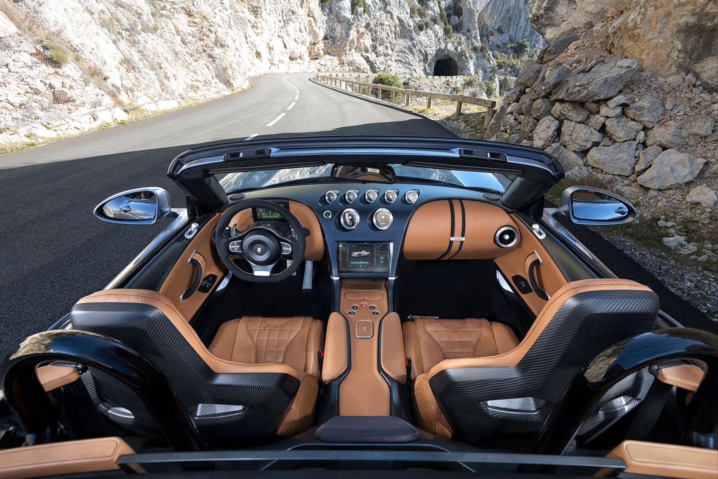 The interior of a convertible sports car is shown