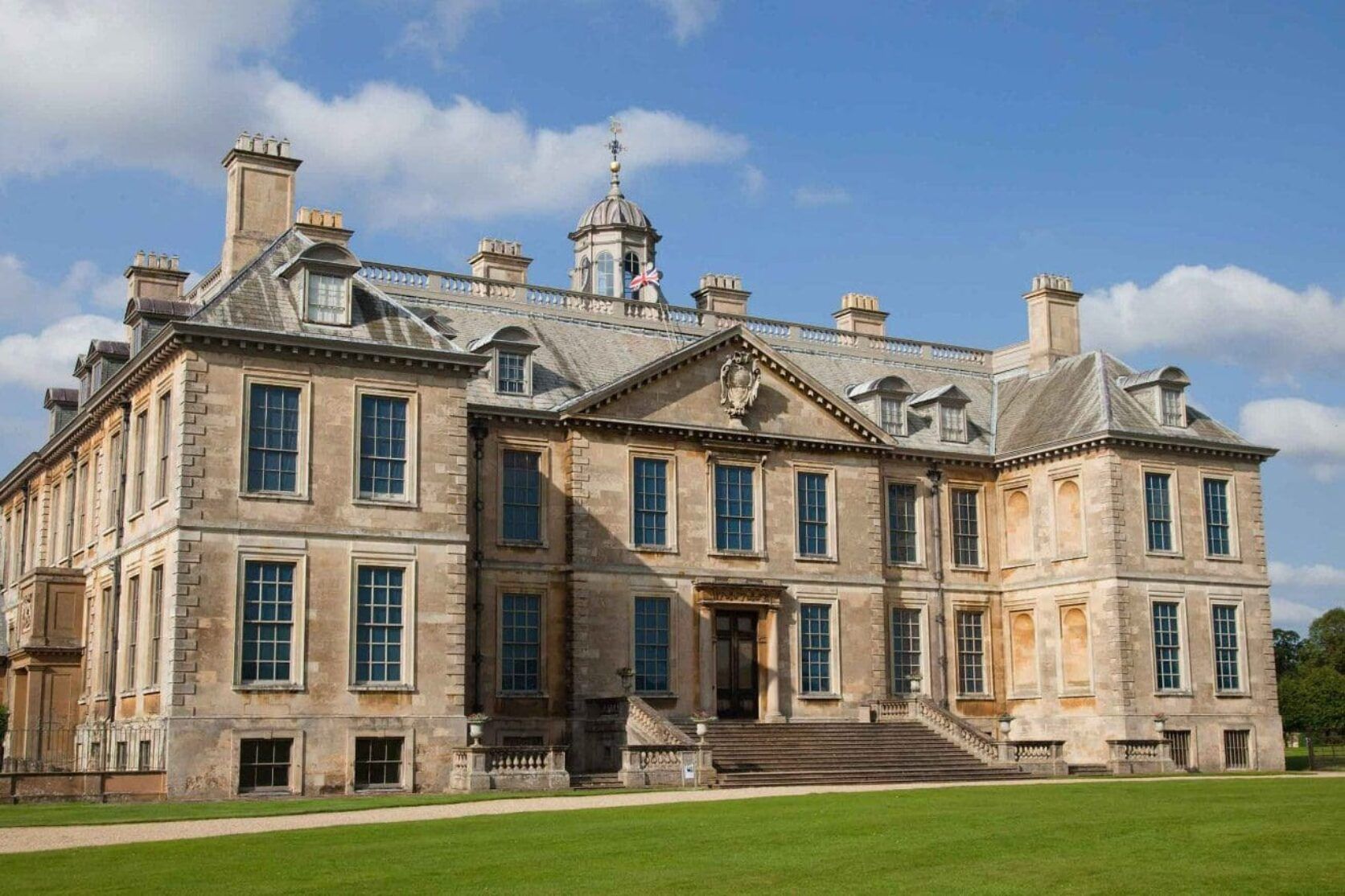 A large stone building with a clock tower on top of it