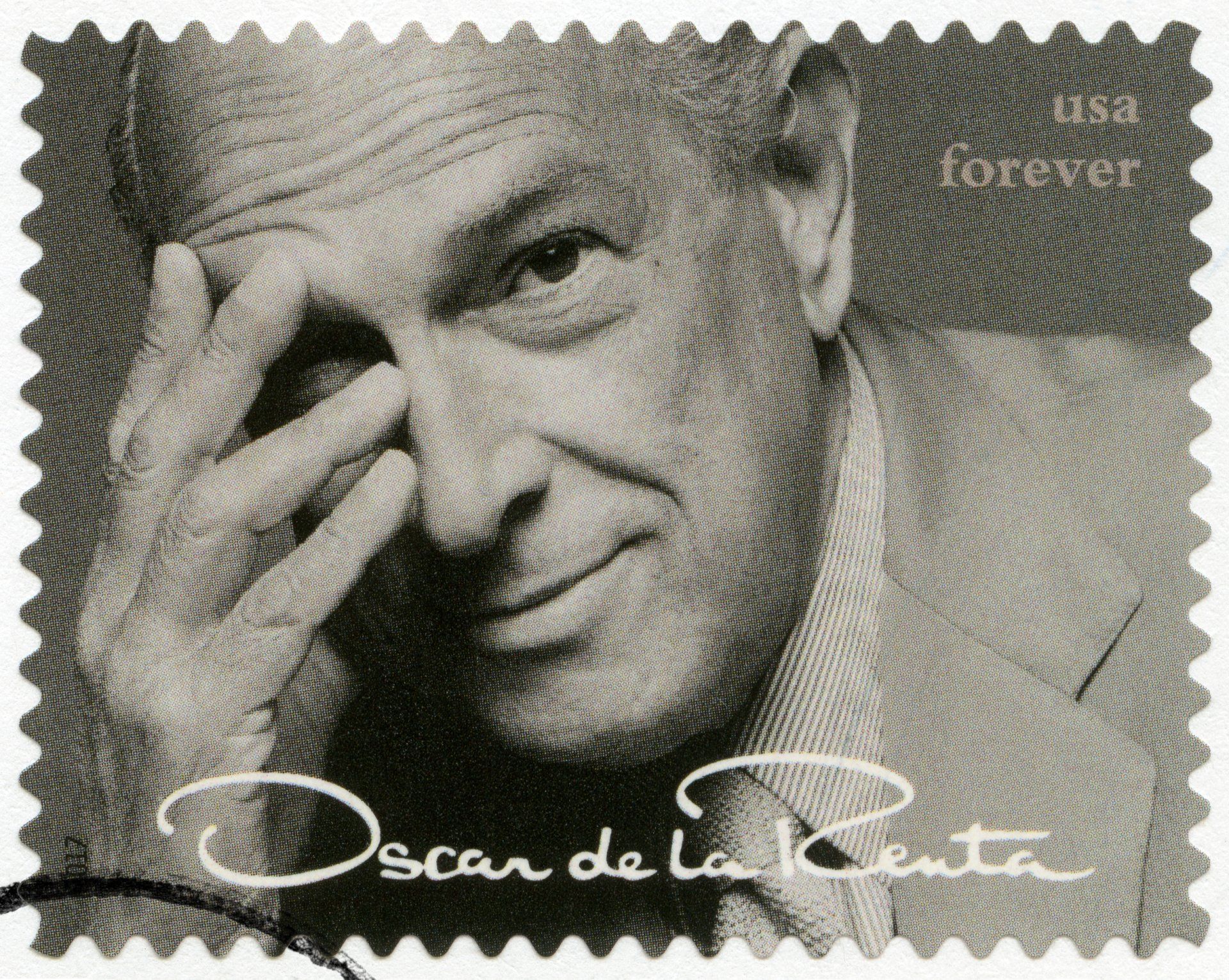 A black and white photo of oscar de la renta