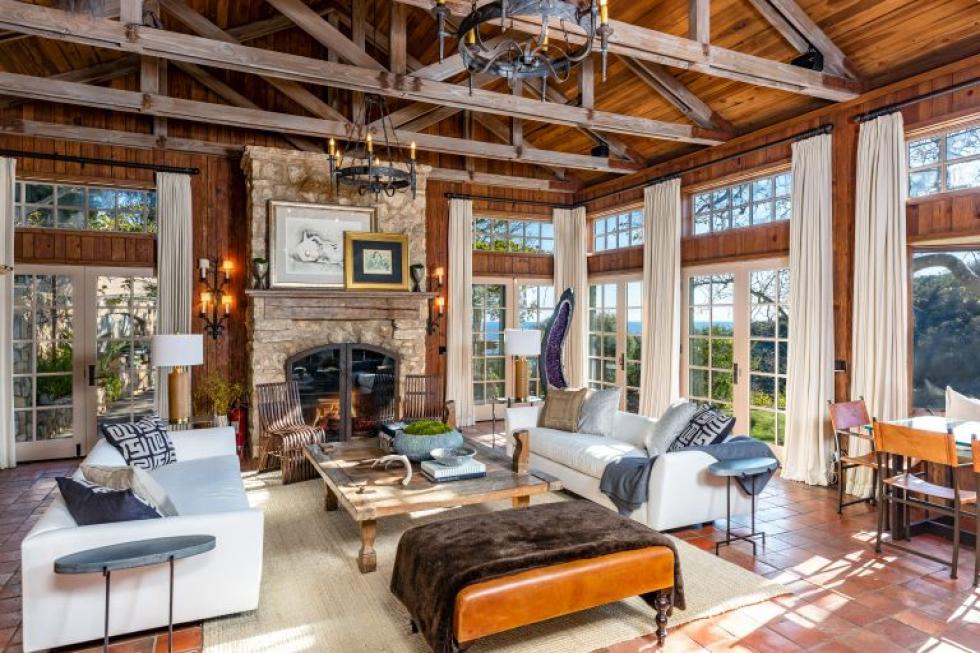 A living room filled with furniture and a fireplace.